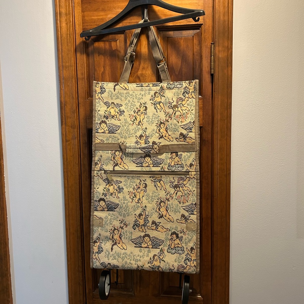 Pionee Cherub Elegant Tapestry Rolling Bag with wheels. Folds compact for travel